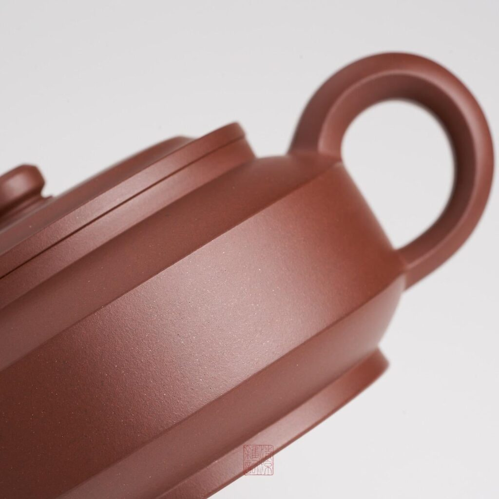 A Yixing teapot body with even burnishing that shows the natural sandiness of the clay