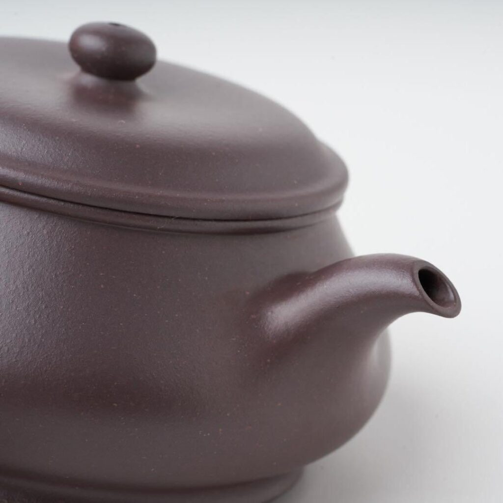 The spout of a Minglu Yixing teapot blending into the body without a visible seam